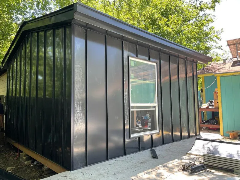 Black standing seam metal wall panels for Metal Roof Installation in Medfield